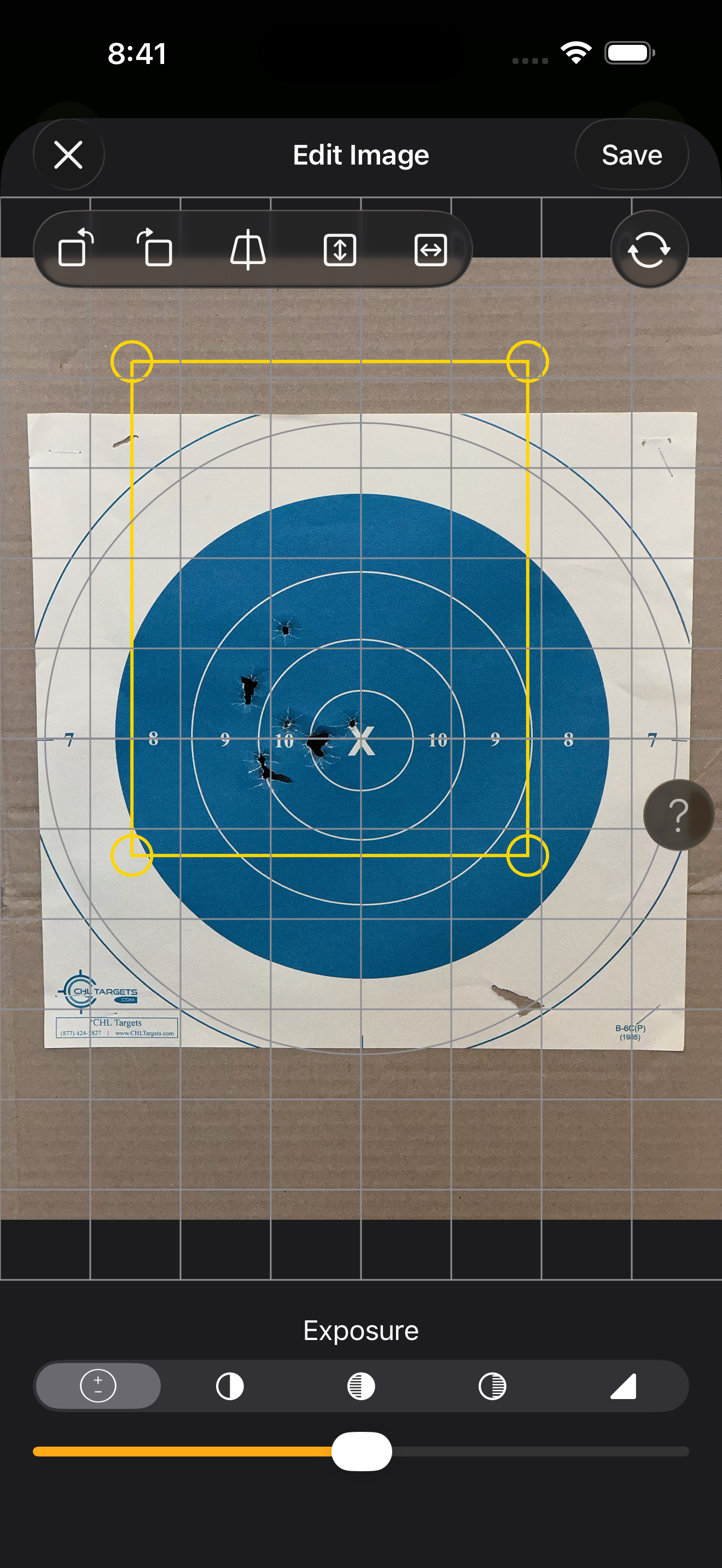 The Edit Image screen showing a target photo with yellow perspective-correction grid overlaid and an Exposure filter slider at the bottom